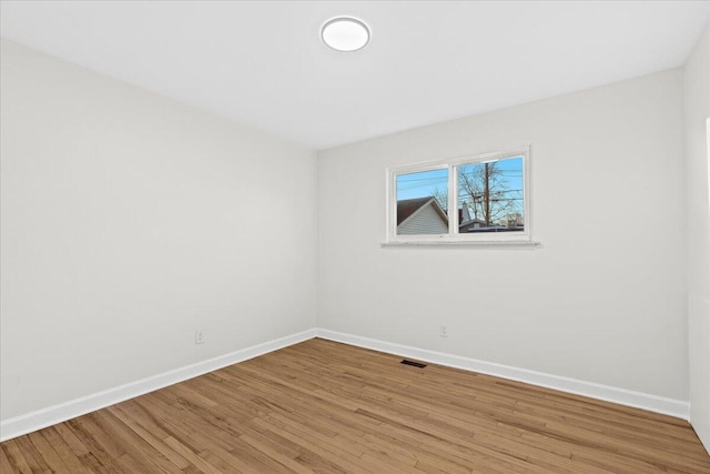 unfurnished room with light hardwood / wood-style flooring