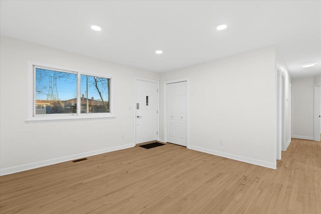 empty room with light wood-type flooring