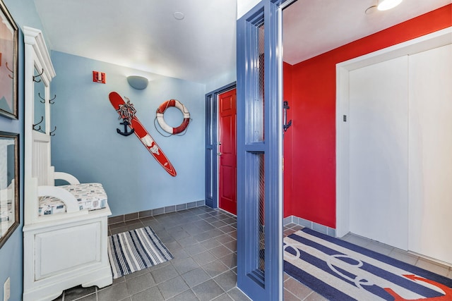 interior space featuring dark tile patterned floors