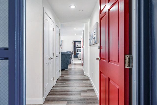 hall with dark hardwood / wood-style flooring