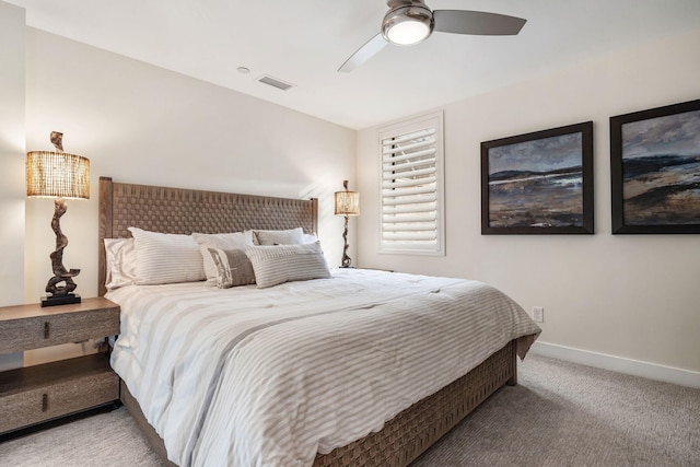 bedroom featuring ceiling fan and light carpet