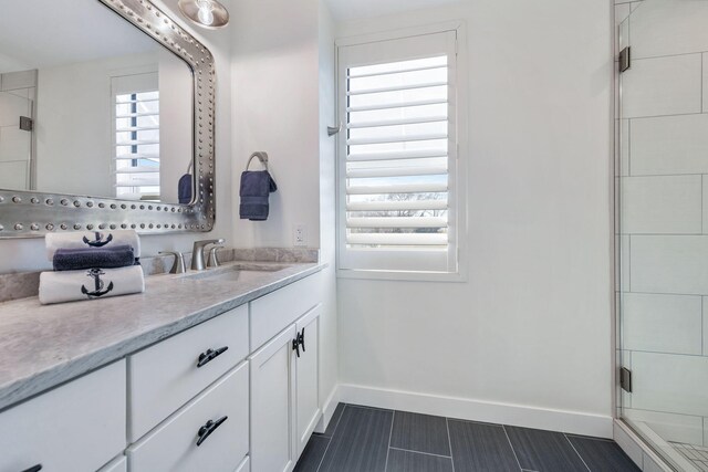 bathroom with vanity and walk in shower