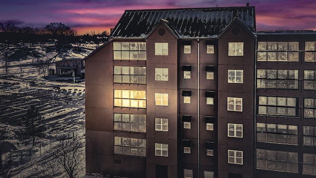 view of outdoor building at dusk