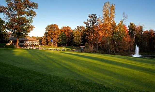 7519 9th St Unit 311, Canadian Lakes, MI 49346 - view of property's community featuring a lawn and golf course view
