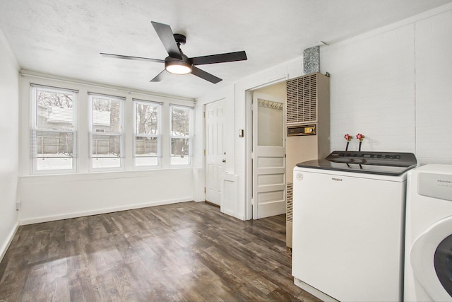 laundry area featuring a textured ceiling, dark hardwood / wood-style floors, washer and clothes dryer, and ceiling fan