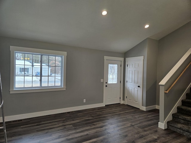 entrance foyer featuring baseboards, stairway, vaulted ceiling, and dark wood-type flooring