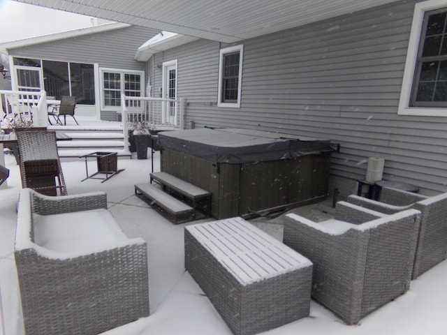 view of patio / terrace with a hot tub and outdoor lounge area