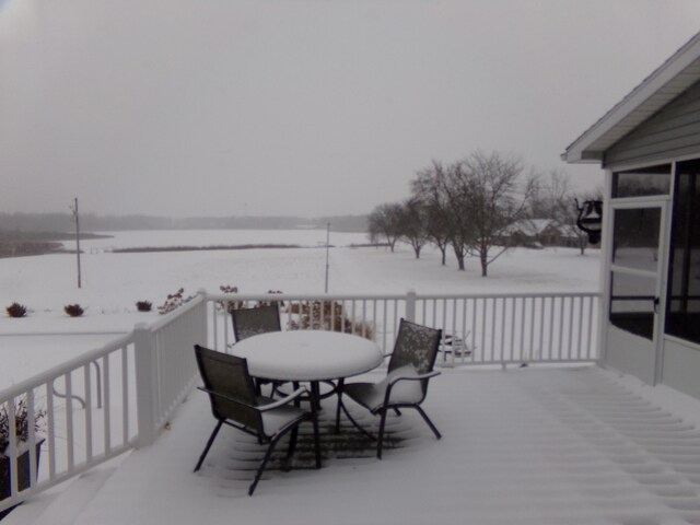 view of snow covered deck