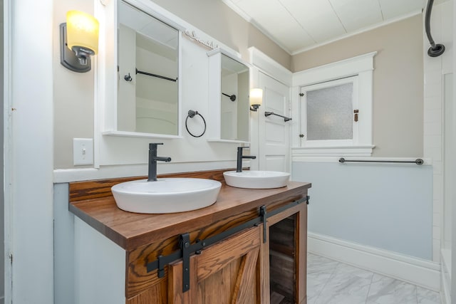 bathroom featuring vanity and ornamental molding