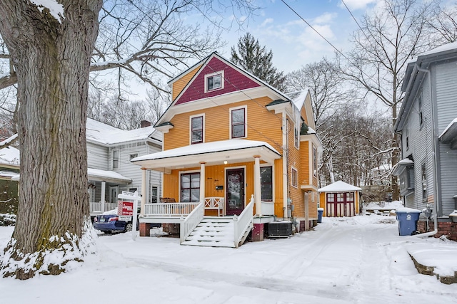 view of front of property with a porch and cooling unit