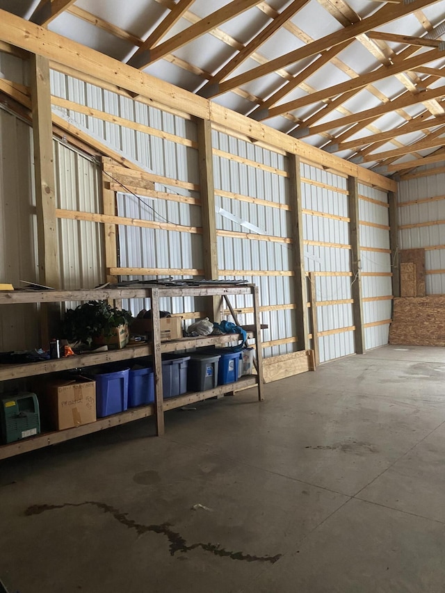 interior space with concrete floors and vaulted ceiling