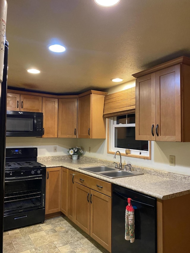 kitchen with sink and black appliances