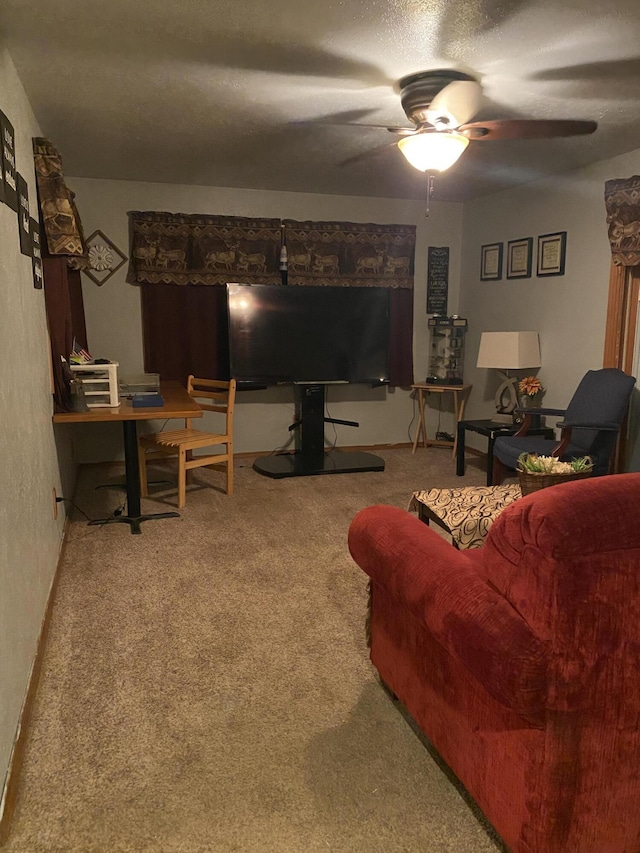 carpeted living room featuring ceiling fan