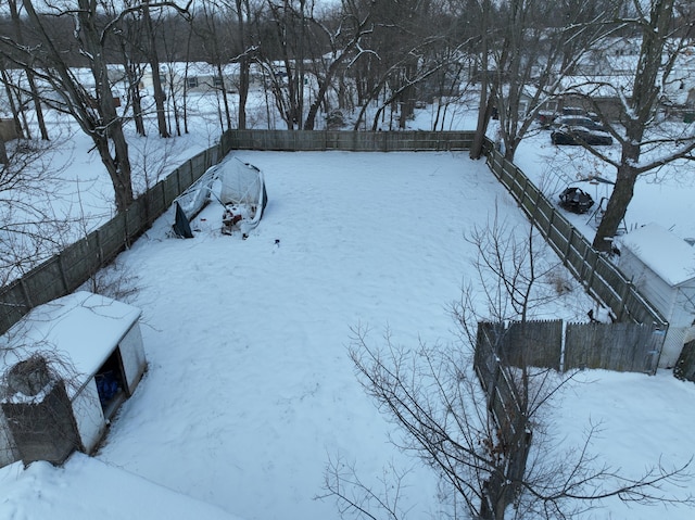 view of yard layered in snow