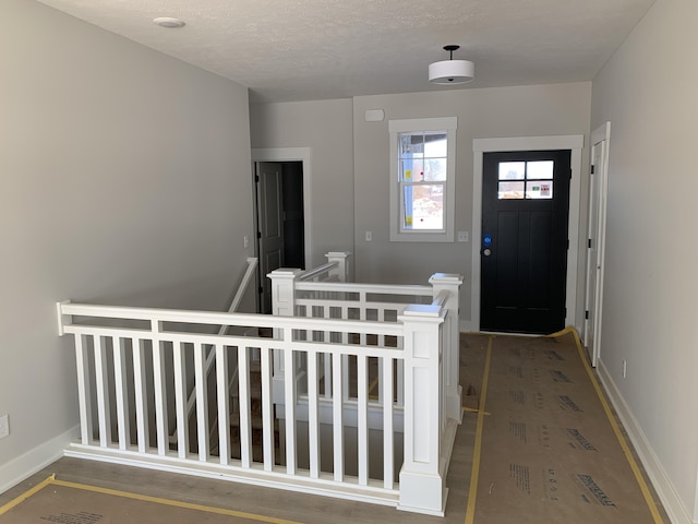 foyer featuring a textured ceiling