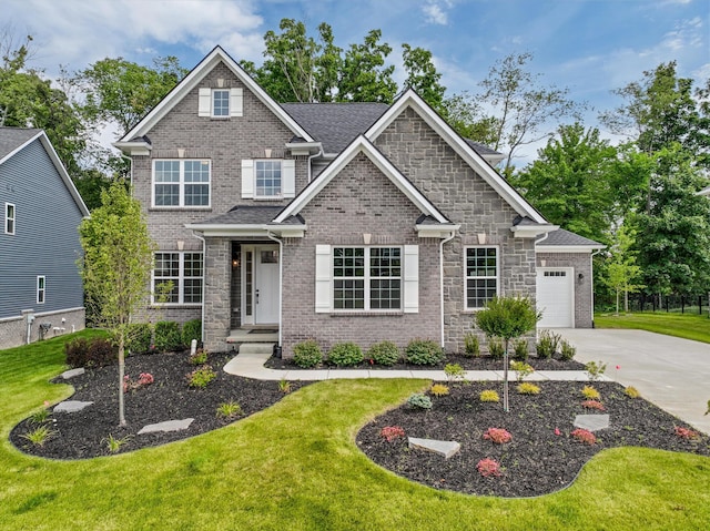 craftsman-style home with a front yard and a garage