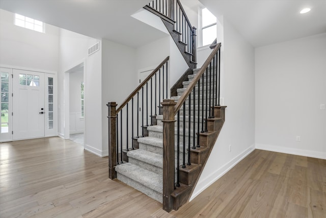 foyer with plenty of natural light and light hardwood / wood-style flooring