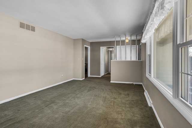 empty room featuring dark colored carpet