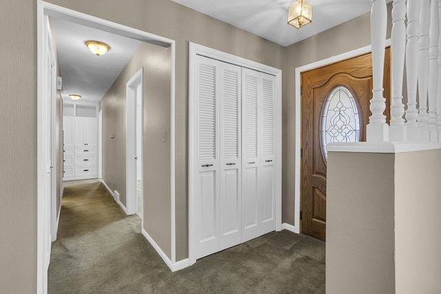 view of carpeted foyer