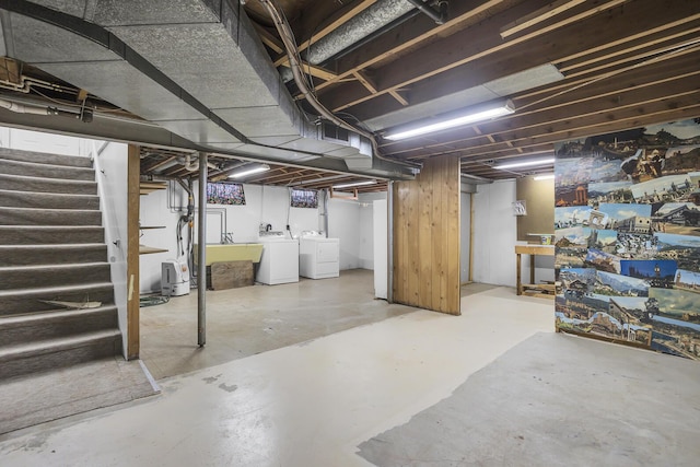 basement featuring sink and washer and clothes dryer