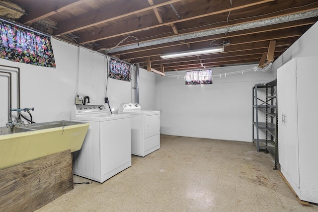 basement with sink and independent washer and dryer