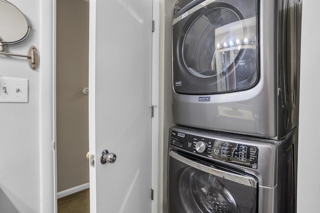 washroom featuring stacked washer and dryer