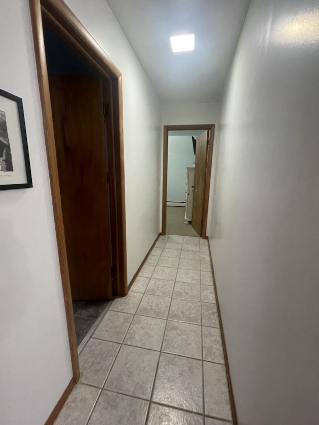 hall with light tile patterned flooring