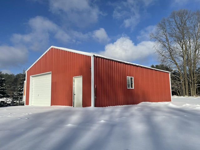 view of snow covered garage