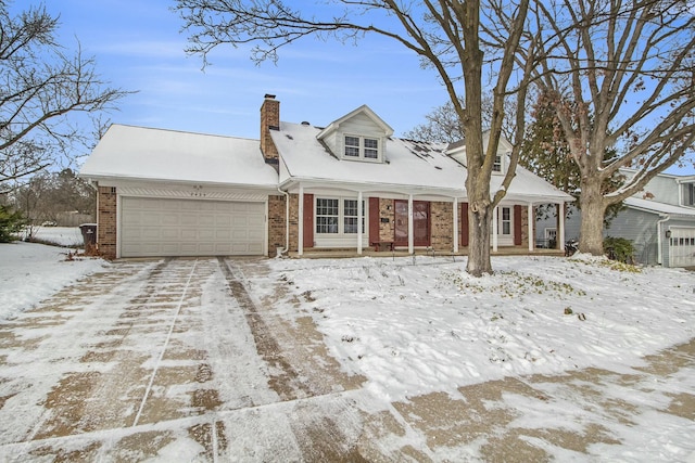 cape cod home with a garage