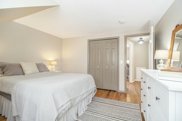 bedroom featuring a closet and light hardwood / wood-style flooring