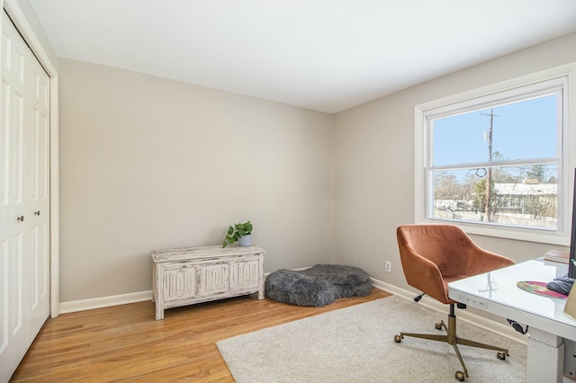 office space with light hardwood / wood-style flooring