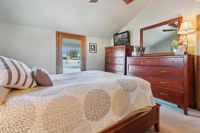 carpeted bedroom with ceiling fan and lofted ceiling