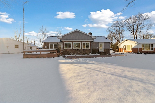 view of snow covered house