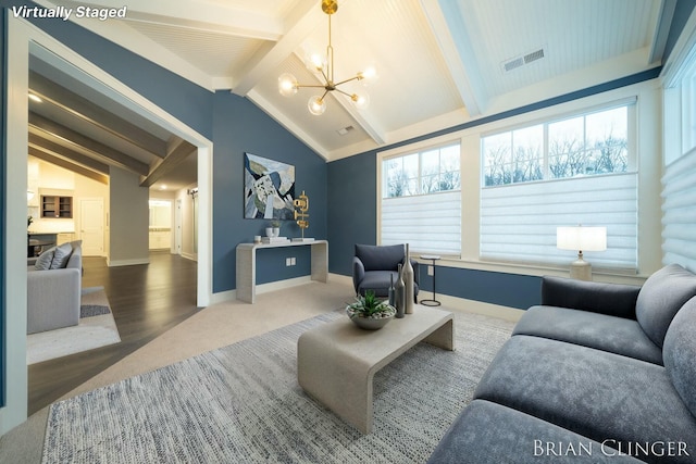 living room with hardwood / wood-style flooring, vaulted ceiling with beams, and an inviting chandelier