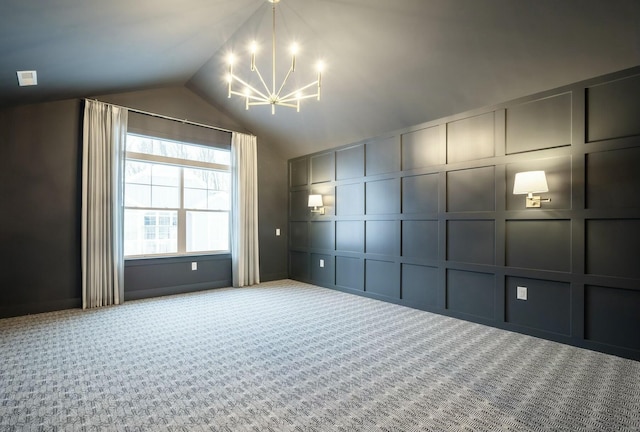 additional living space featuring vaulted ceiling, carpet flooring, and a chandelier