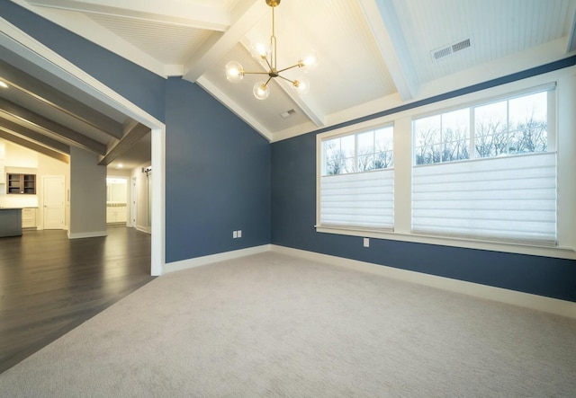 empty room featuring an inviting chandelier, dark colored carpet, and vaulted ceiling with beams