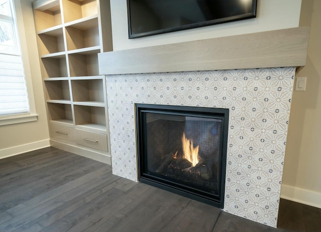 interior details with hardwood / wood-style floors and a fireplace