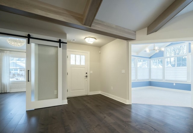 foyer featuring vaulted ceiling with beams, dark wood-type flooring, and a barn door