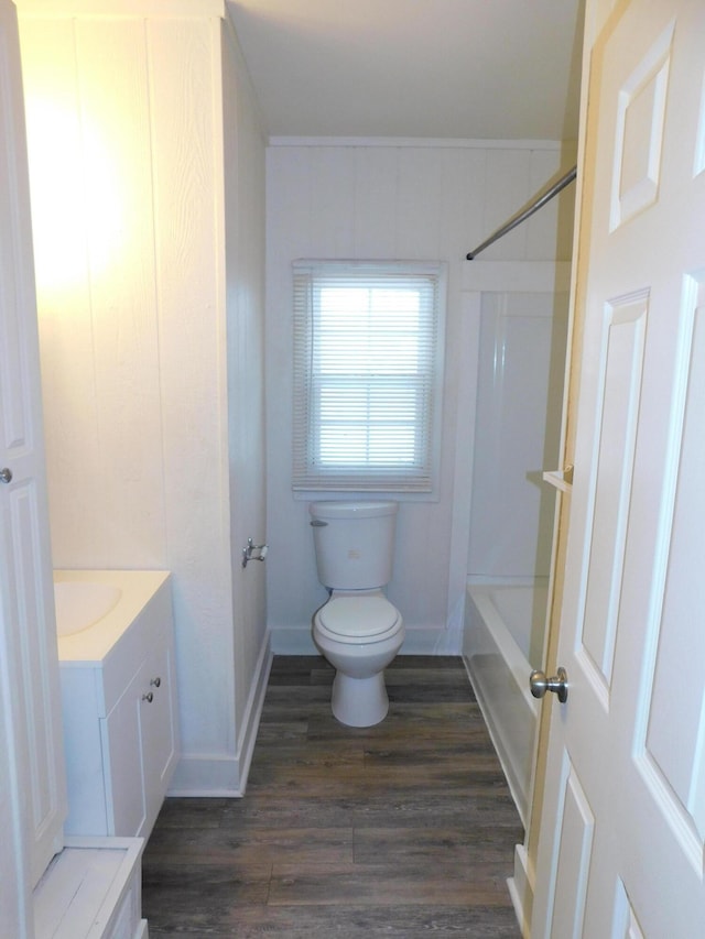 full bathroom featuring toilet, vanity, hardwood / wood-style floors, and tub / shower combination