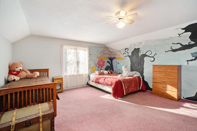 bedroom with ceiling fan, vaulted ceiling, carpet, and a textured ceiling