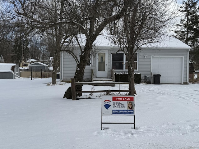 view of front of property featuring a garage