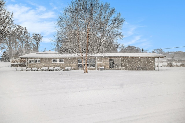 view of snow covered house