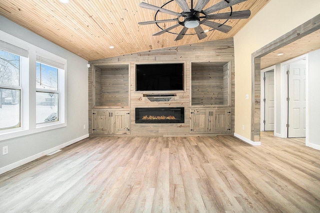 unfurnished living room featuring a fireplace, lofted ceiling, wood ceiling, ceiling fan, and wood finished floors