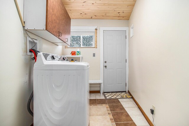 laundry room featuring washer / dryer, wood ceiling, cabinet space, and baseboards