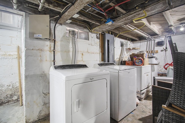 clothes washing area featuring washer and dryer