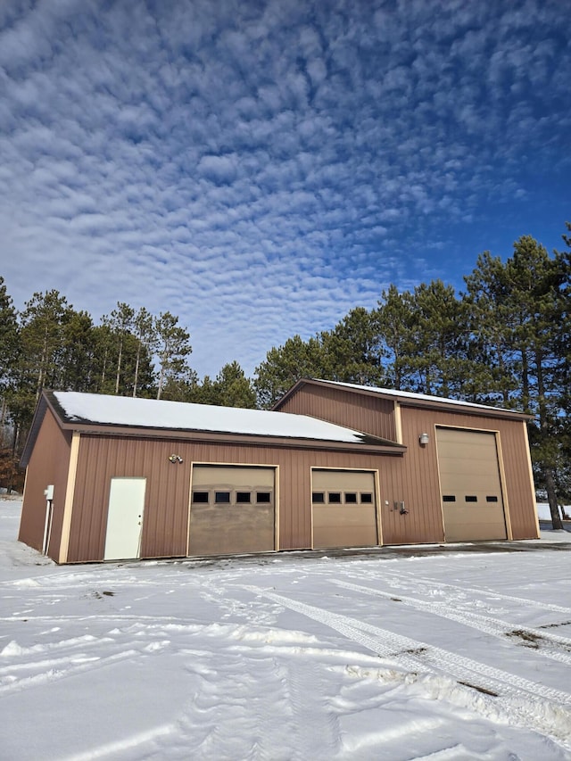 view of snow covered garage