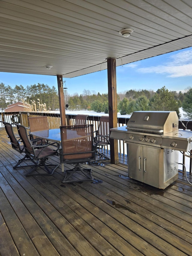 wooden terrace featuring area for grilling