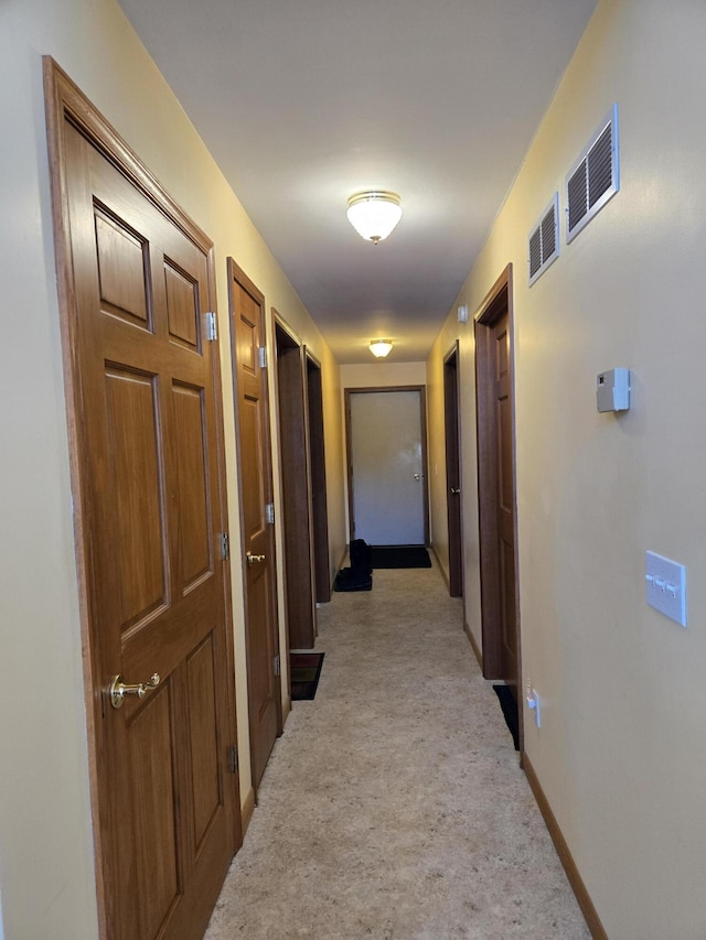 hallway with light carpet