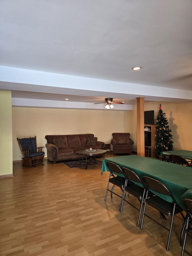 rec room featuring light wood-type flooring and ceiling fan