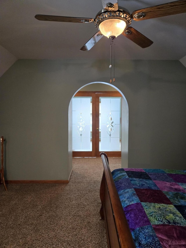 bedroom with ceiling fan, carpet, and lofted ceiling